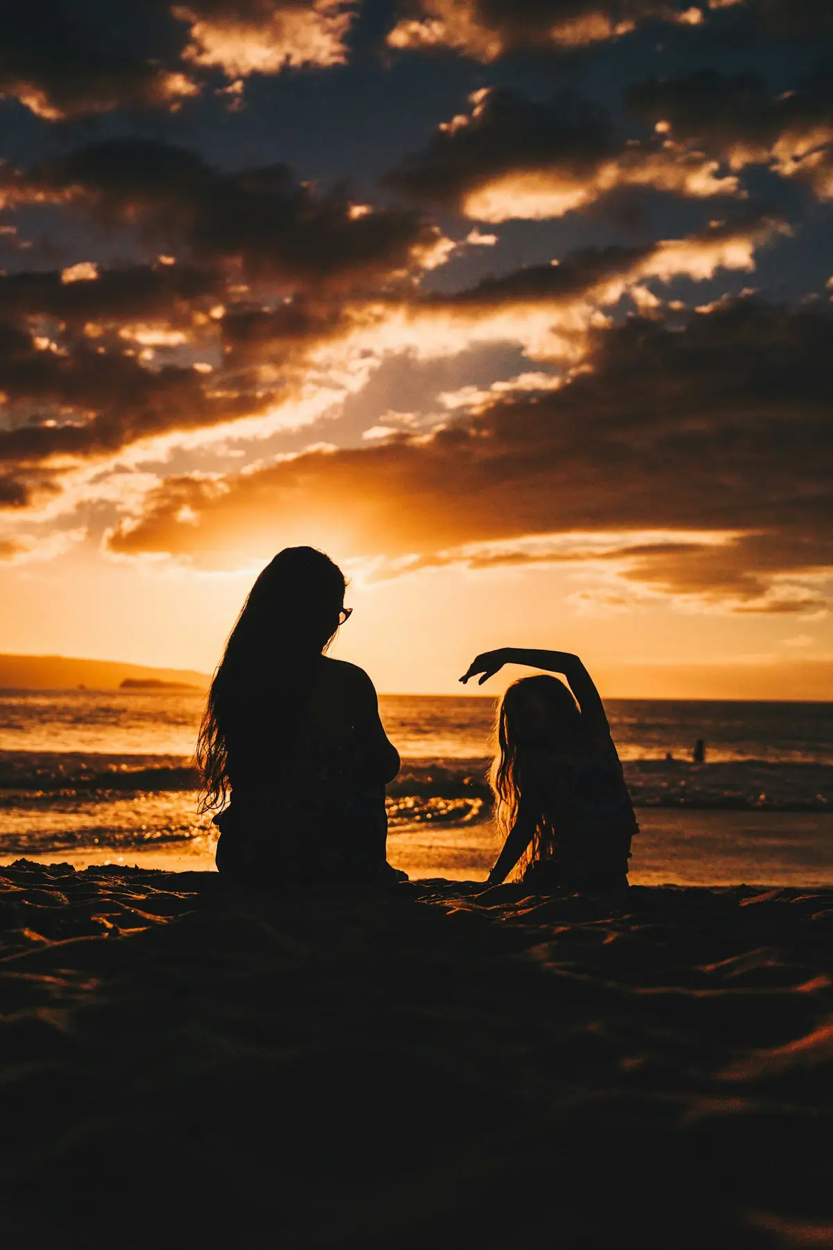 Mother and Daughter Sitting Together